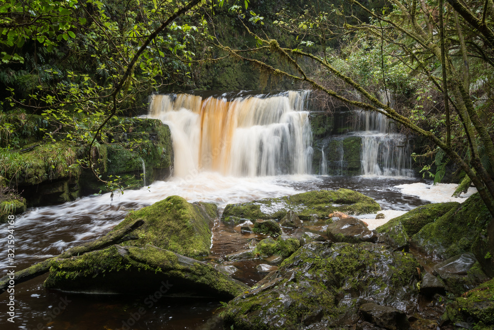 Fototapeta premium The Chute running high below McLean Falls in the Catlins, Otago, New Zealand. Long exposure.