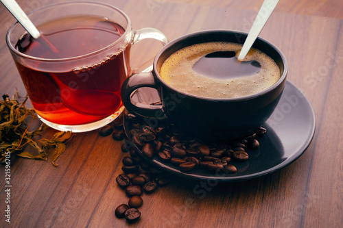 Hot coffee and hot tea on the wooden floor