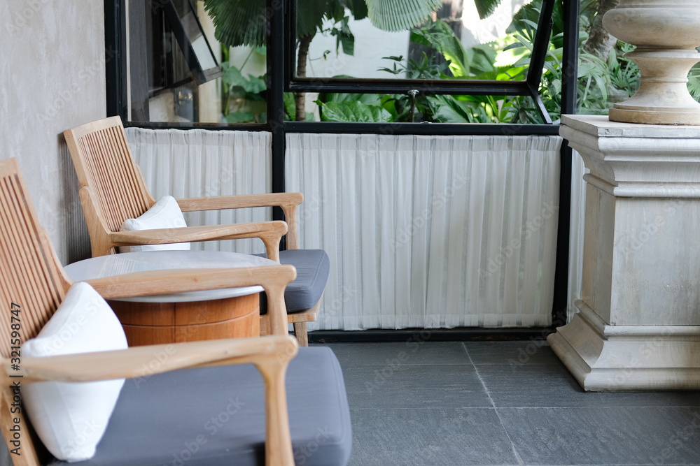 Fototapeta premium pillow cushion on wooden chair in hotel resort in living room
