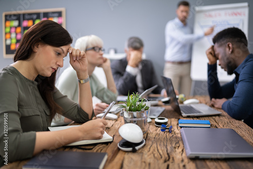 Businesspeople Getting Bored In Office photo