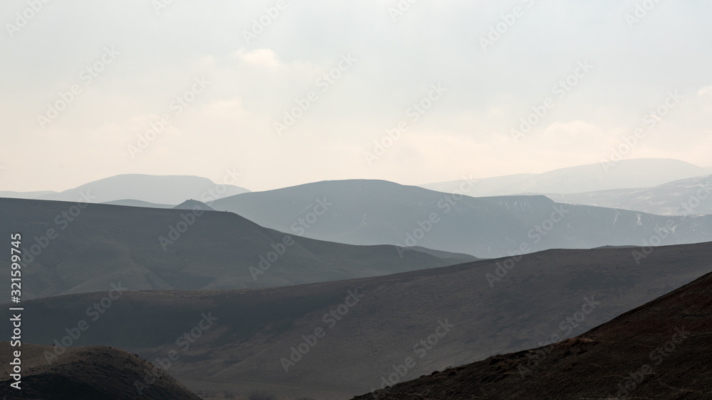 Mountain silhouettes in the haze