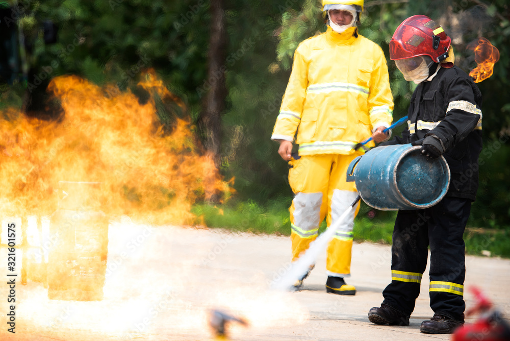 The instructor shows how to use a fire extinguisher on the Training Division in Thailand. The instructor shows how to use a fire extinguisher on the Training Division in Thailand.