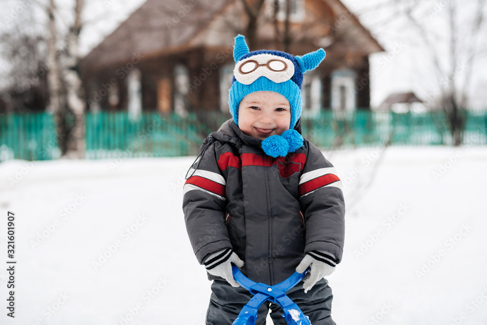 funny cute happy baby boy smiling outside on snow funny cute happy baby boy smiling outside on snow