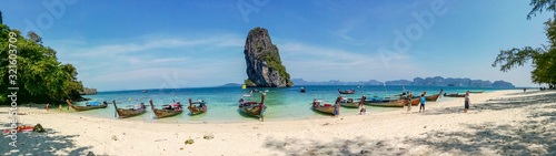 Panorama view of longtail boat parked to wait for tourists at Ao Nang  beach, Thailand.. © Atiwat