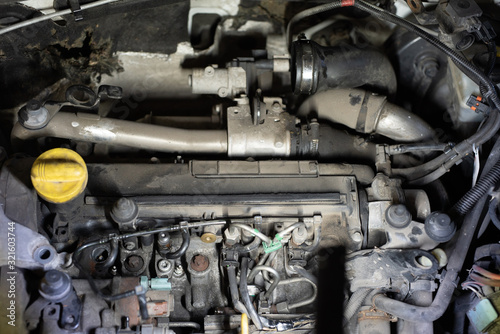 dismantled car engine in a car workshop