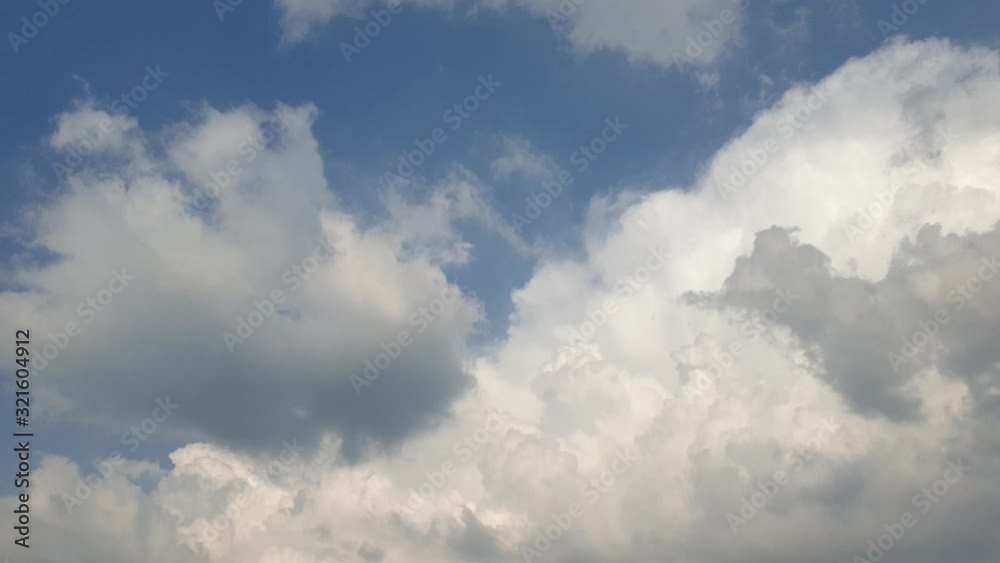 Beautiful blue summer sky with dense thick rain clouds moving across the horizon cloudscape time lapse Beautiful blue summer sky with dense thick rain clouds moving across the horizon cloudscape time lapse