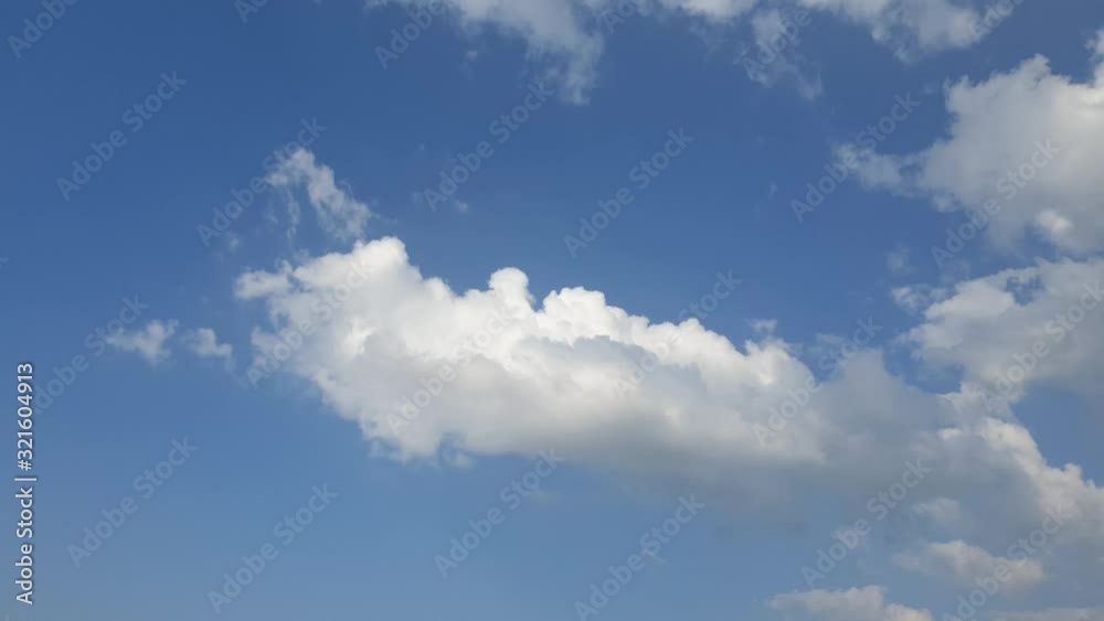 Beautiful blue summer sky with dense thick rain clouds moving across the horizon cloudscape time lapse Beautiful blue summer sky with dense thick rain clouds moving across the horizon cloudscape time lapse