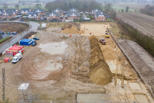  drone image of a large construction site where the floor is being prepared for a factory building