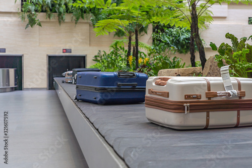 Photography Passenger luggage on conveyor belt at arrival terminal in airport