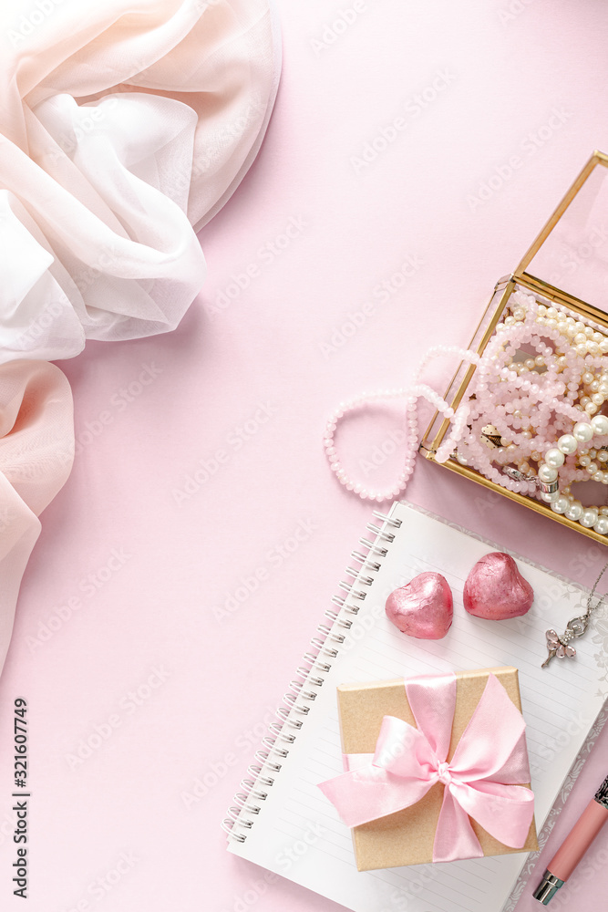 Gift box or gift box and flowers on pink table top view. Flat lay. Birthday, wedding, valentines day, march 8th concept. copy space Gift box or gift box and flowers on pink table top view. Flat lay. Birthday, wedding, valentines day, march 8th concept. copy space