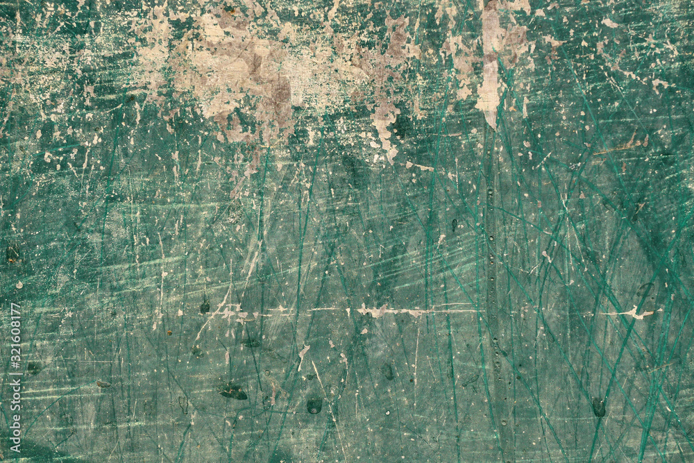 Green wall surface with white scratches , Grunge background and  texture of old metal for add text or graphic design 