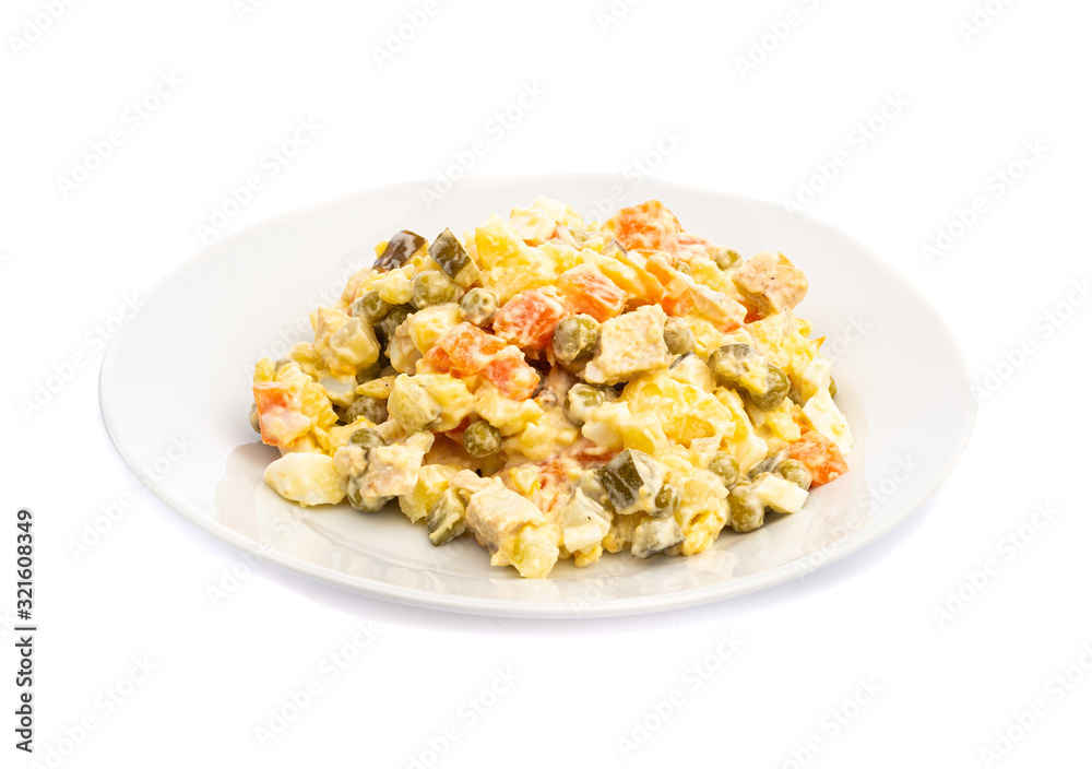 salad of different ingredients on a white plate on a wooden background salad of different ingredients on a white plate on a wooden background