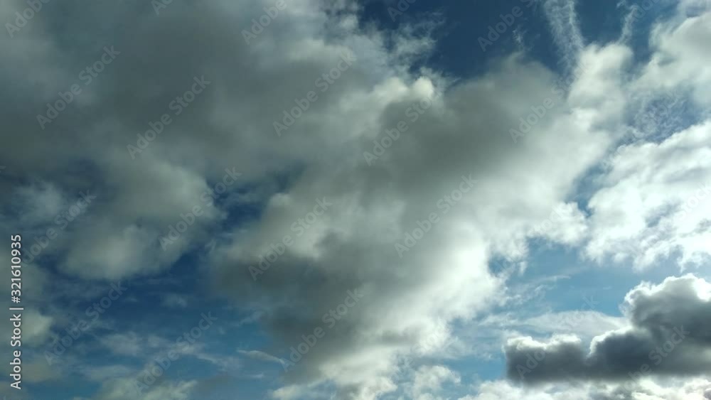Clouds flying through the winter sky. Snow-carrying clouds driven by the wind through the cold winter sky. Clouds flying through the winter sky. Snow-carrying clouds driven by the wind through the cold winter sky.