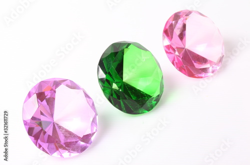 Purple, green and pink diamond on white background