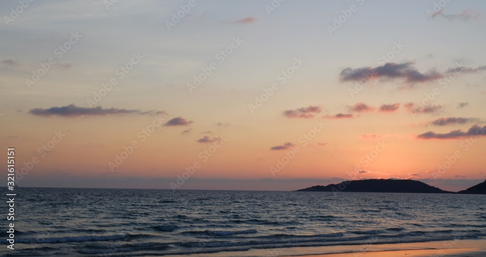 Sunset beautiful golden yellow. Beach, sea, sandy beach. On twilight.
