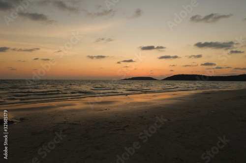 Sunset beautiful golden yellow. Beach, sea, sandy beach. On twilight.