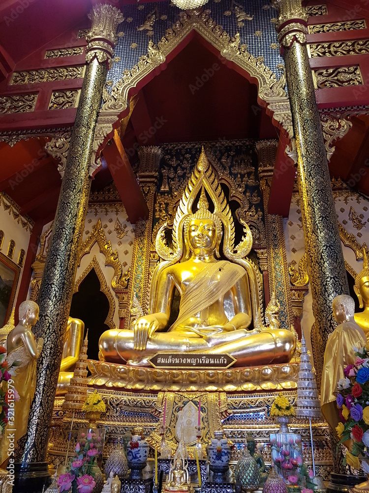 Beautiful golden Buddha statue in Thai temple.