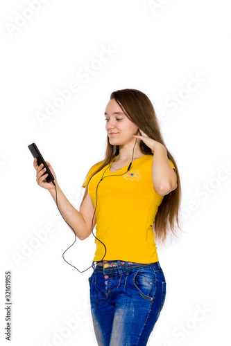 A teenager at the age of 14 listening to music isolated on a white background