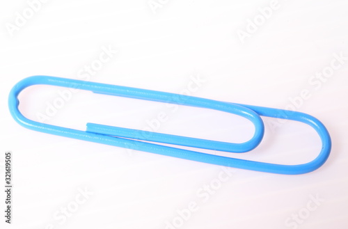 blue paper clip isolated on white