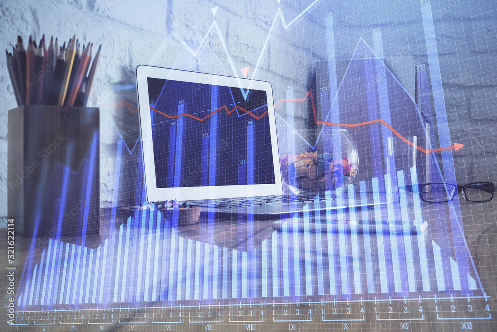 Multi exposure of forex graph and work space with computer. Concept of international online trading. Multi exposure of forex graph and work space with computer. Concept of international online trading.