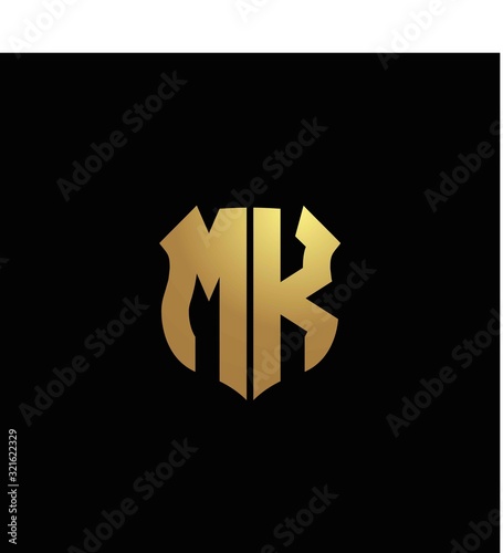 MK logo monogram with gold colors and shield shape design template photo