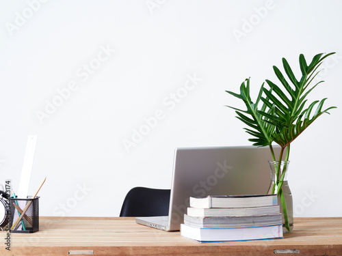 Laptop on office desk wood table.