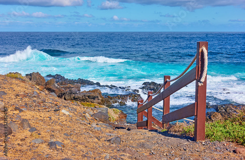 Railed footpath on the coast of Tenerife by the sea