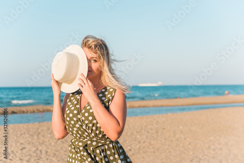 Spring - Summer season. Vacation and travelling time. Woman at sea, pretty nice view  photo