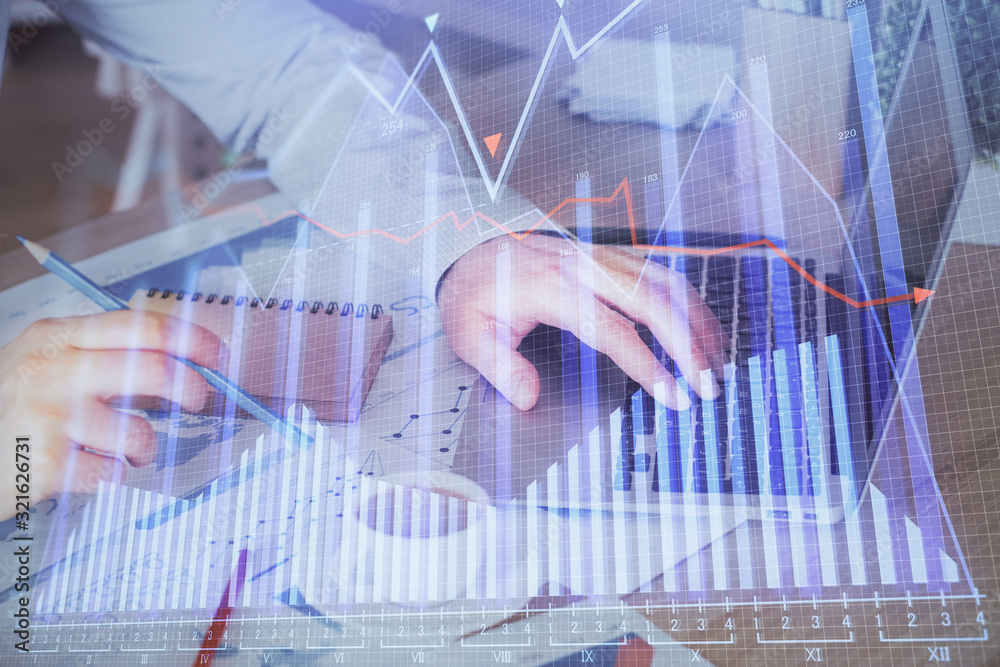 Forex graph with businessman working on computer in office on background. Concept of hardworking. Multi exposure. Forex graph with businessman working on computer in office on background. Concept of hardworking. Multi exposure.