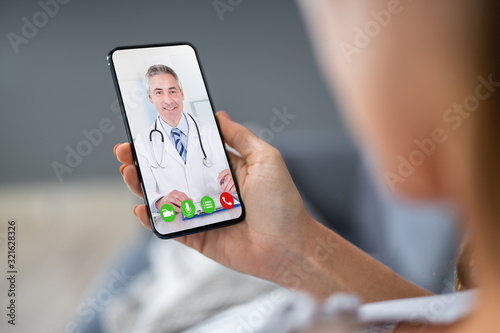 Person Videochatting With Doctor photo