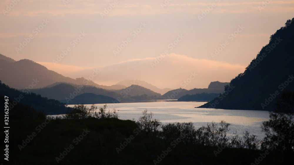 Beautiful sunset over lake and mountains, Norway.. Beautiful sunset over lake and mountains, Norway..
