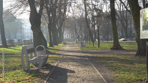 The park during the spring on a sunny day. In the background the small traffic road visible [Central Europe].