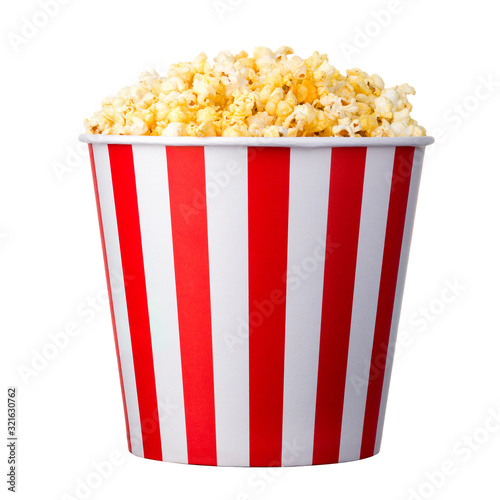 Paper striped bucket with popcorn isolated on white background photo