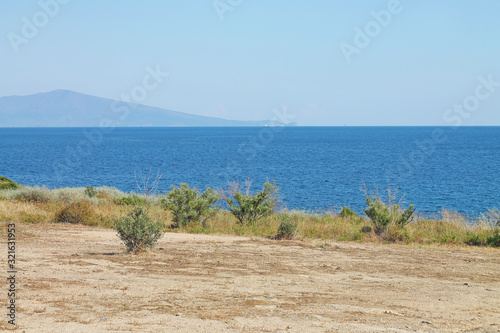 A coast of Aegean Sea near Nea Paramos. Famous Varasidas beach. Greece photo