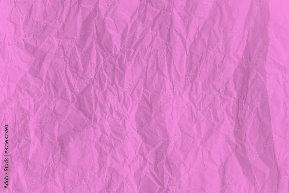 Fototapeta premium Pink crumpled paper close up texture background