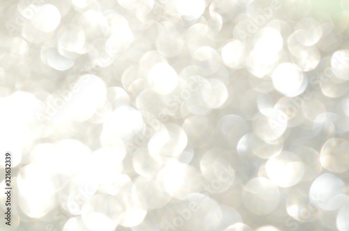 Abstract glittering sheet bokeh reflected in sunlight