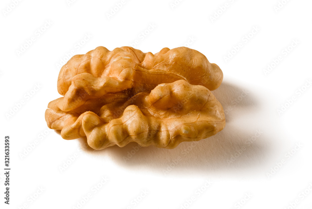Still life with a walnut peeled on white background. Still life with a walnut peeled on white background.