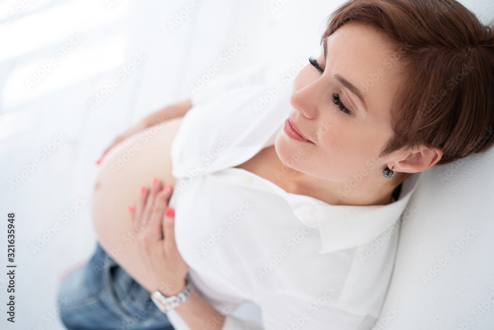Stylish Woman Dreams Of Stroking Her Stomach In The Last Trimester Of Pregnancy Stylish Woman Dreams Of Stroking Her Stomach In The Last Trimester Of Pregnancy