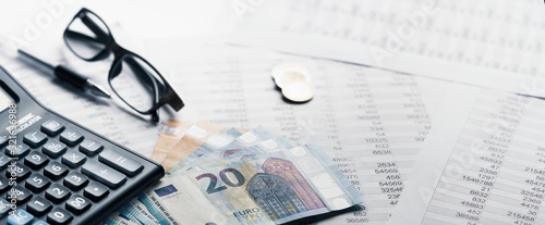 Close-up banner Pen Calculator And money On Financial Report - Business Accounting Concept