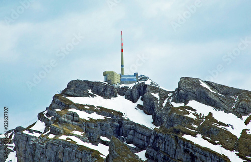 The beautiful and dominant alpine peak of Säntis (Santis or Saentis) in Alpstein mountain range, Unterwasser - Canton of St. Gallen, Switzerland photo