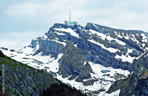 The beautiful and dominant alpine peak of Säntis (Santis or Saentis) in Alpstein mountain range, Unterwasser - Canton of St. Gallen, Switzerland photo