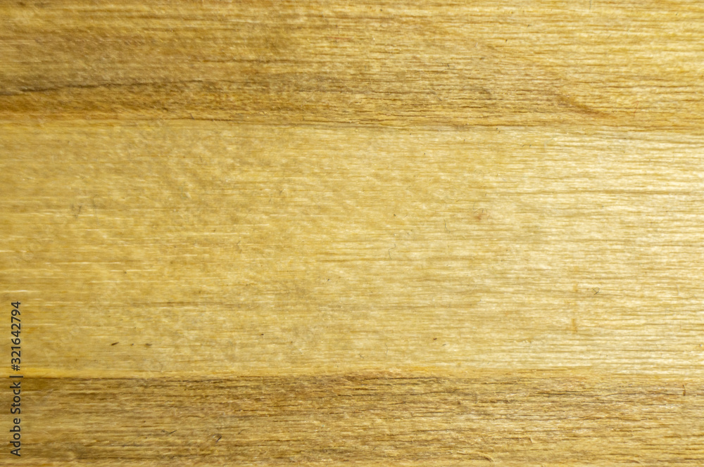 Naklejka premium Wood texture lumber closeup pattern. Macro photo