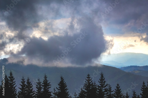 Dark big cloud on top of mountain, thunderstorm in mountains_