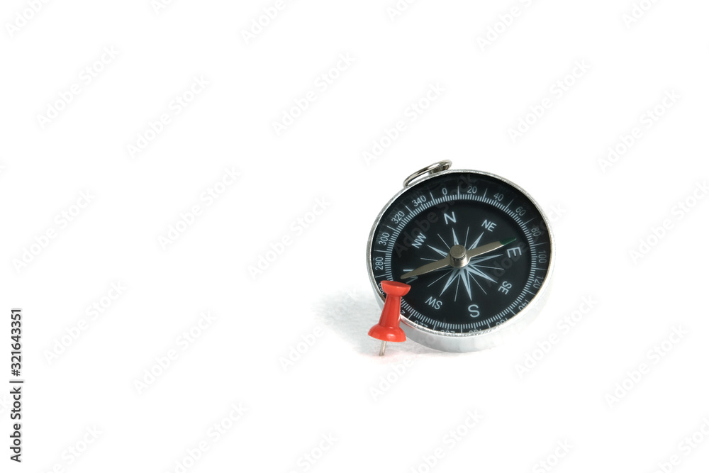 embedded red thumbtack / pushpin with compass isolated on white background embedded red thumbtack / pushpin with compass isolated on white background