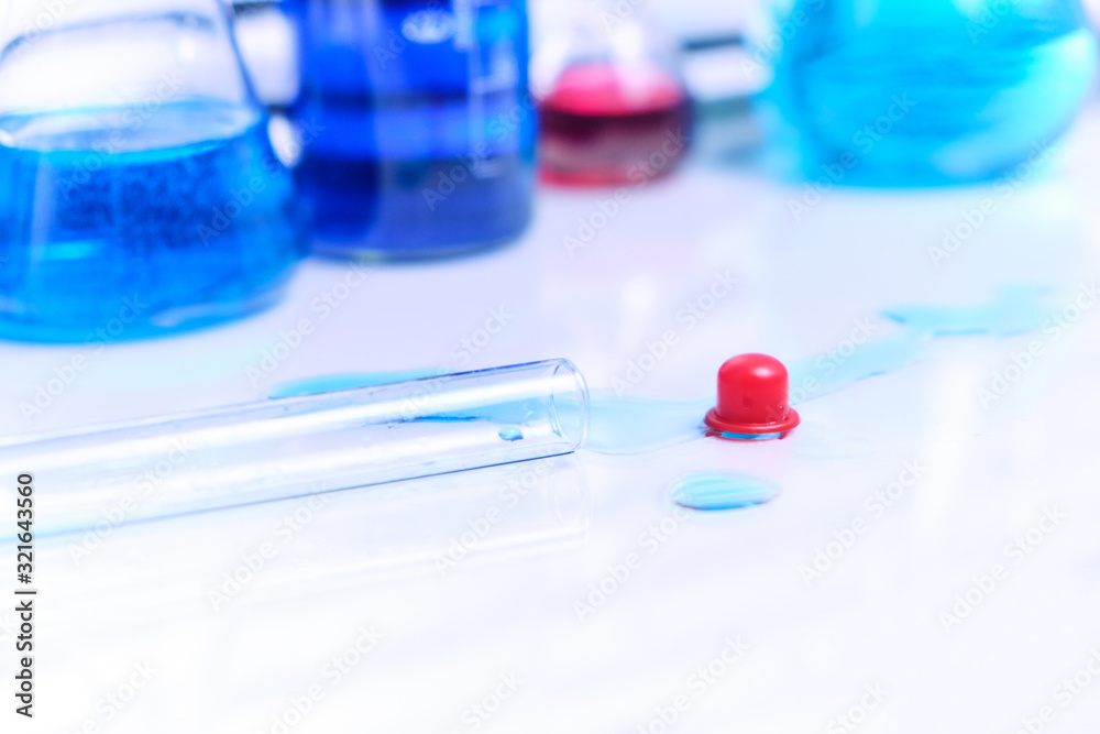 Spilled blue liquid on the lab table in the lab. Violation of quarantine security.Danger of infection. Spilled blue liquid on the lab table in the lab. Violation of quarantine security.Danger of infection.