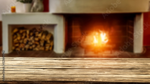 Desk of free space and fireplace in home interior 