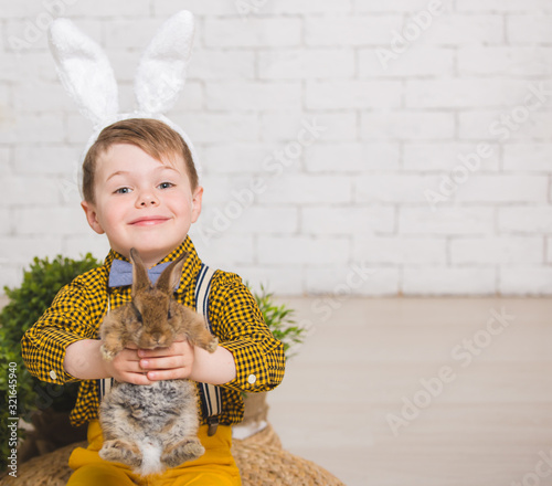 Boy with a rabbit photo