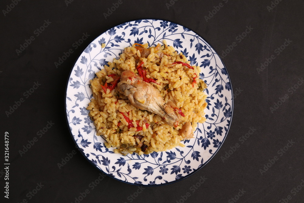 plate of rice with chicken and peppers