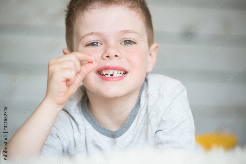 Teenager child with a tooth dropped out Teenager child with a tooth dropped out