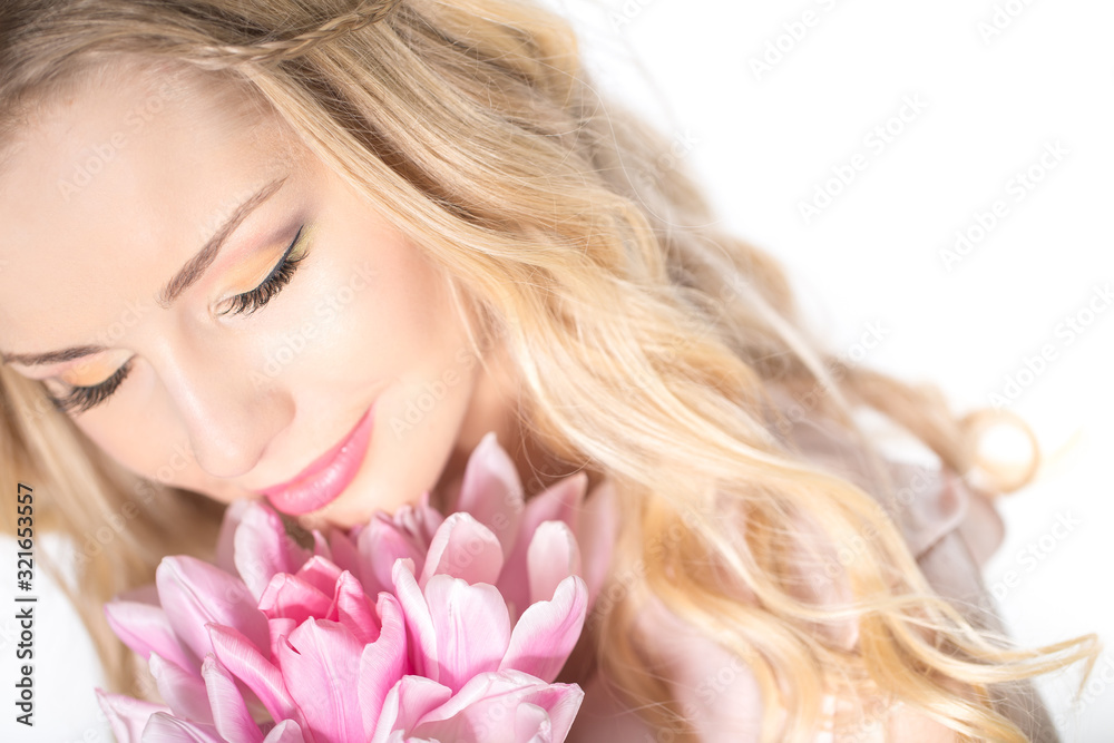 Luxurious blonde with a bouquet of tulips Luxurious blonde with a bouquet of tulips
